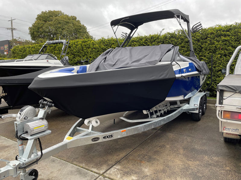 Malibu Axis travel cover installed on wake boat during towing